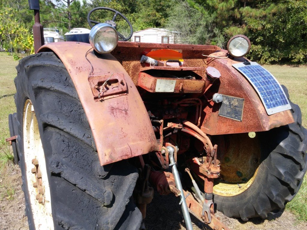 Old tractor keeps a hot battery with solar power.